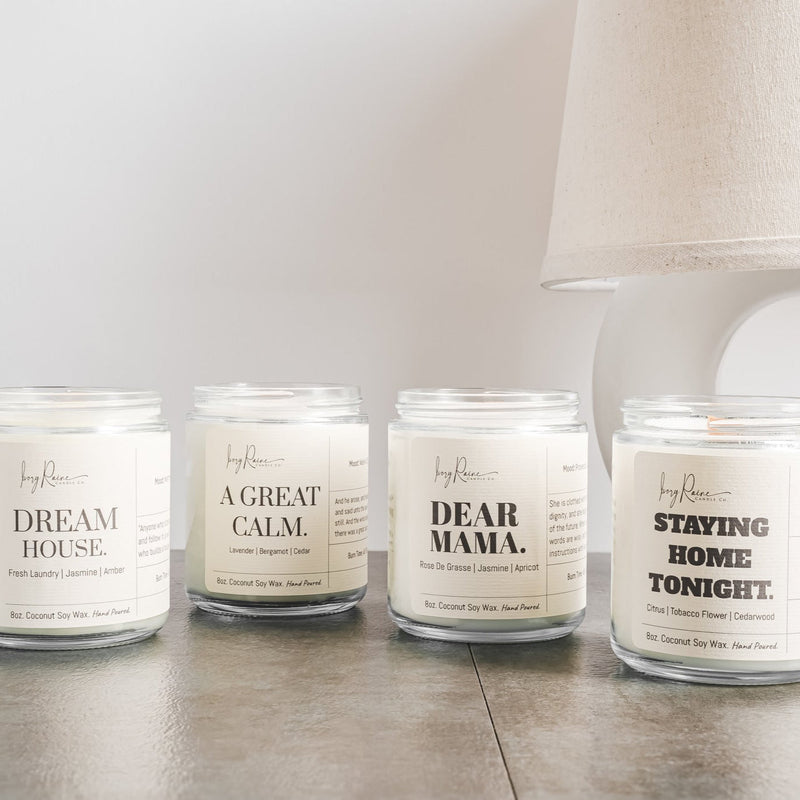 4 Ivory Raine Original candles sitting side by side.
