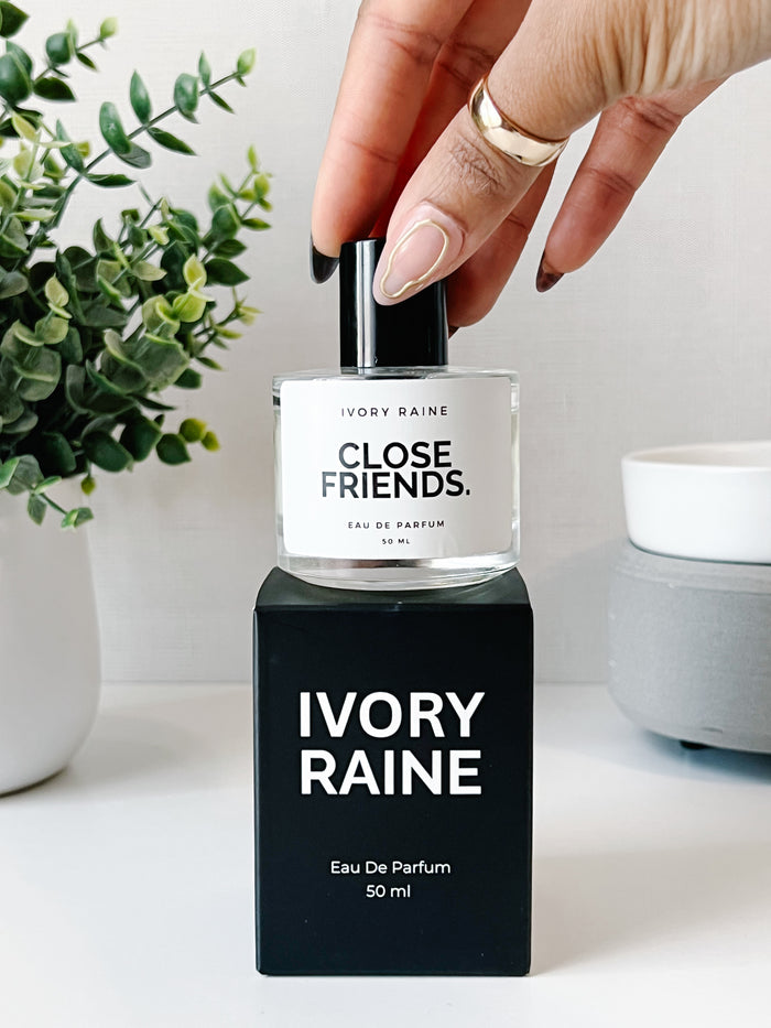Close Friends perfume on top of Ivory Raine packaging