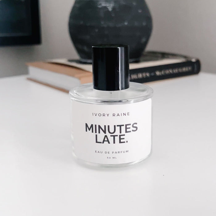 Minutes Late perfume on white counter