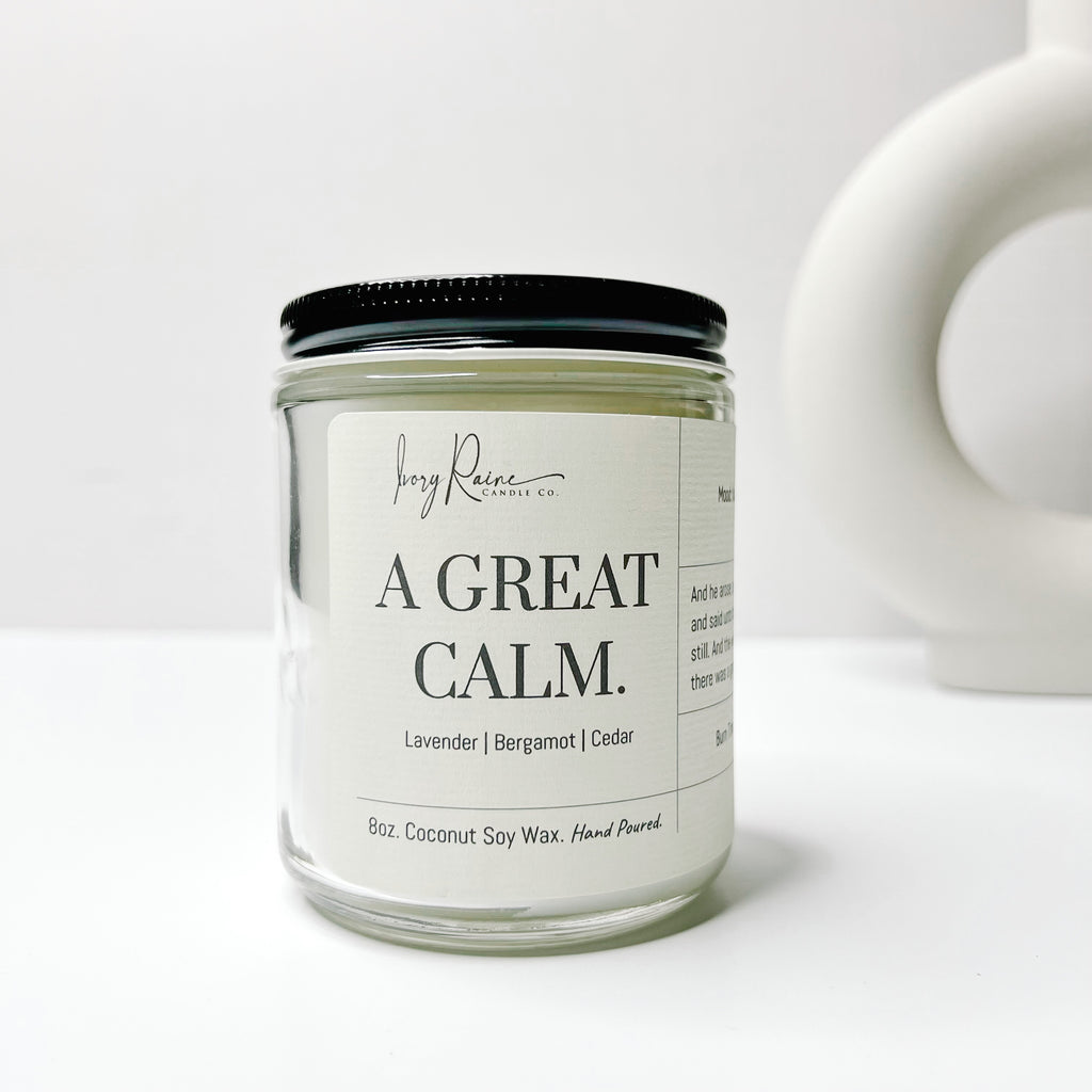 A Great Calm 8oz wood wick candle that smells like Lavender, Bergamot, and Cedar.
